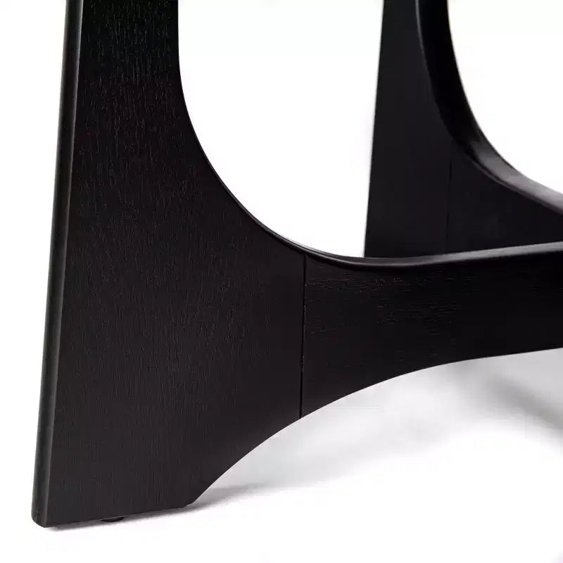 Tavolino rotondo nero con base a piedistallo scultorea